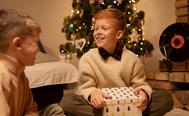 image of a kid receiving a gift